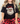 black t-shirt with a Santa Claus graphic